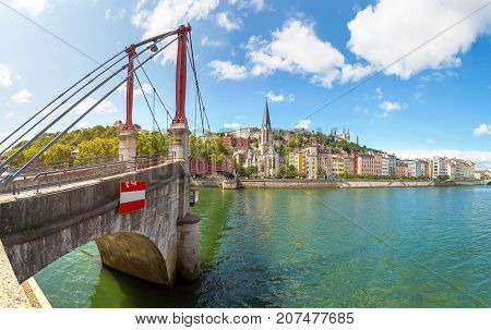 Pedestrian Saint Georges Footbridge And The Saint Georges Church In Lyon France In A Beautiful Summe
