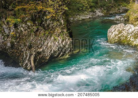Nature autumn landscape. Waterfall at Soteska Vintgar Slovenia. The Vintgar Gorge or Bled Gorge.