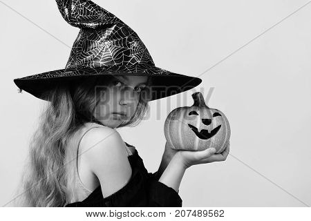 Child In Witch Costume And Jack O Lantern