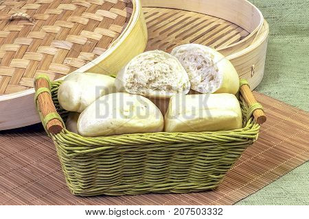 Steam buns in a bamboo basket chinese