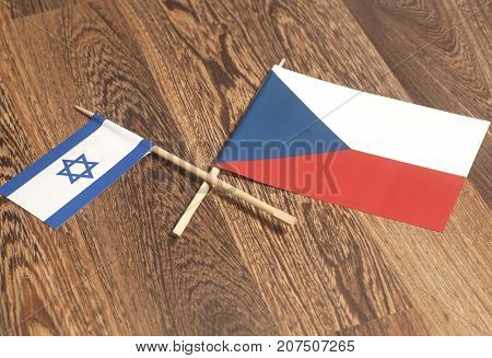 Israel end Czech Republic Flags on a wooden .