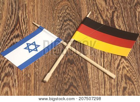 Germany end Israel Flag on wooden background