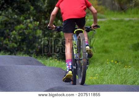 Man Riding Bicycles On Pump Track