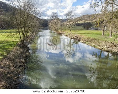 rural riparianl scenery at river Jagst in Hohenlohe a area in Southern Germany at early spring time