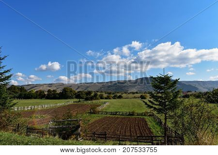 Broad panorama of the countryside in North Croatia with green field in foreground