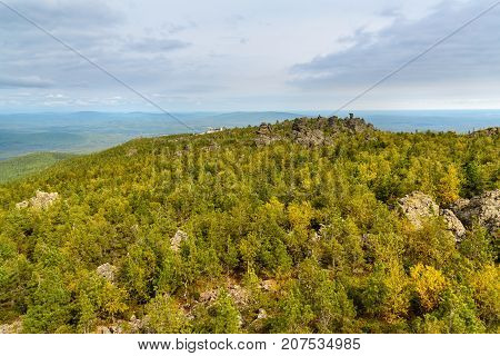 Rocks And Shad Tchup Ling Buddhist Monastery On Mountain Kachkanar. The Urals. Russia