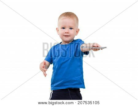 a happy baby is playing on a smartphone
