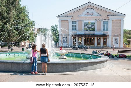 Konotop,Sumy region,Ukraine,  AUGUST  14, 2013: Town Square with theater and a fountain in the city Konotop