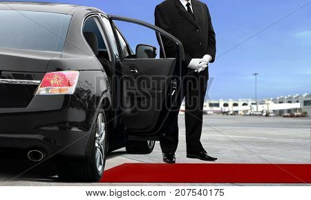 Driver waiting at the airport under blue sky