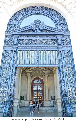 Vienna Austria - August 6 2016: Visitors in the National Imperial library entrance in Helden square