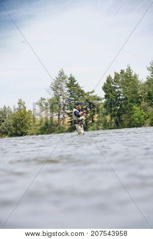 Fly-fisherman fishing in the Gallatin River, Montana
