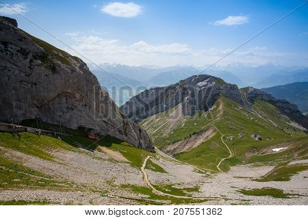 Panorama of the Upper Engadine from Muottas Muragl with very steep trail Switzerland