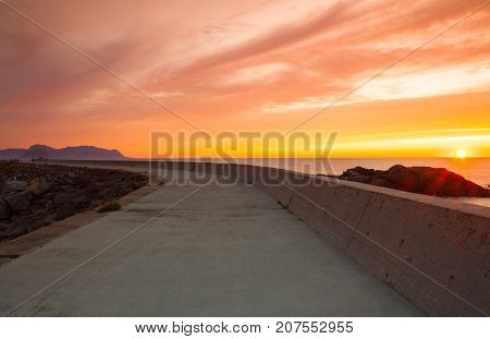 On the pier in Laukvik at sunset Lofoten islands Nordland Norway