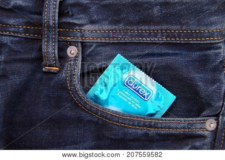 Almere, The Netherlands - October 6, 2017: Durex condom in the pocket of blue jeans.