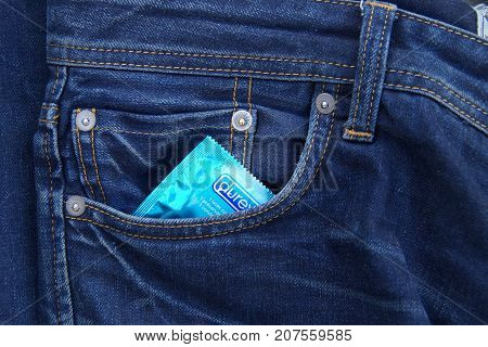 Almere, The Netherlands - October 6, 2017: Durex condom in the pocket of blue jeans.