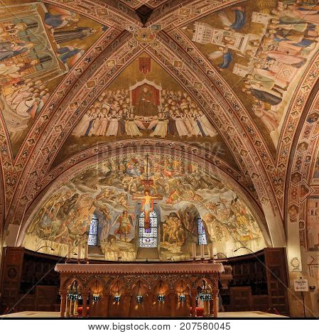 ASSISI ITALY 30 JUNE 2017: Interior Famous Basilica of St. Francis of Assisi (Basilica Papale di San Francesco) with Lower Plaza at sunset in Assisi Umbria Italy