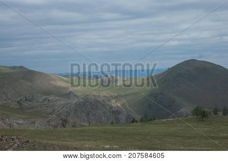 Open landscape of tangerian steppes near lake Baikal, Russia