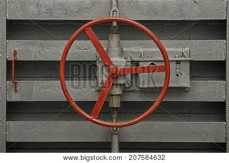 Round handle of the lock of hermetic door of old soviet bomb shelter