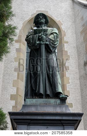 The Monument Of Urlich Zwingli In The Center Of Zurich.