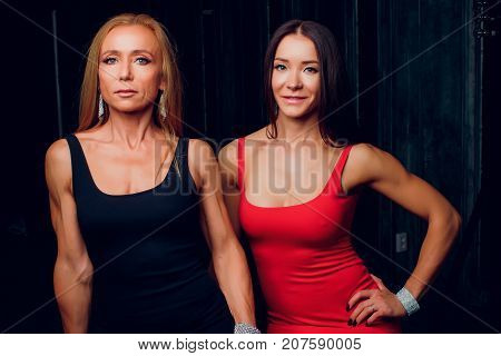 a woman in the Studio dress smile