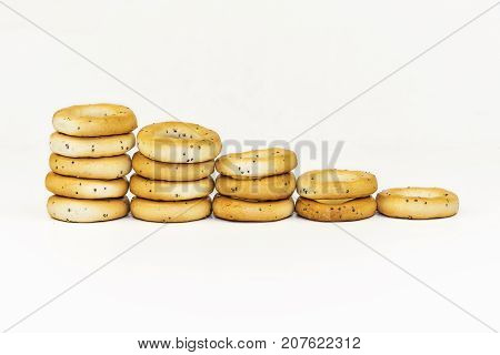 On a white background the drying with poppy seeds is spread out with a ladder