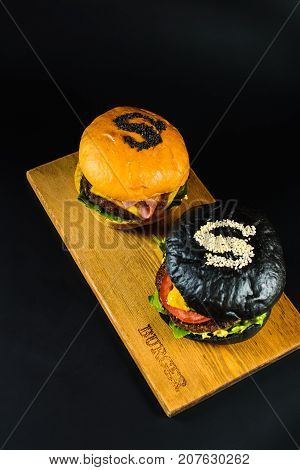 Two Crafting A Burger On The Board