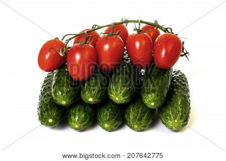 vegetables cucumbers and tomatoes on a white background