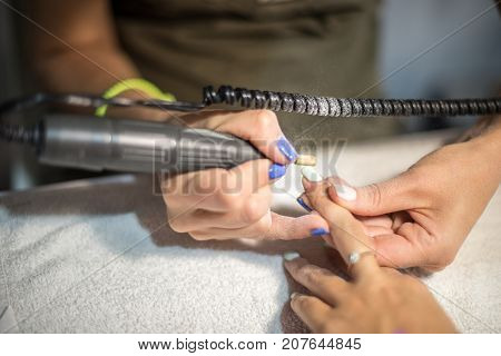 Hardware Manicure. Removal Of Old Gel Varnish In The Salon. Manicure Master Doing Beauty Procedure F