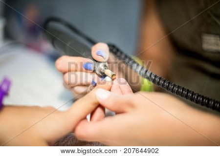 Hardware Manicure. Removal Of Old Gel Varnish In The Salon. Manicure Master Doing Beauty Procedure F