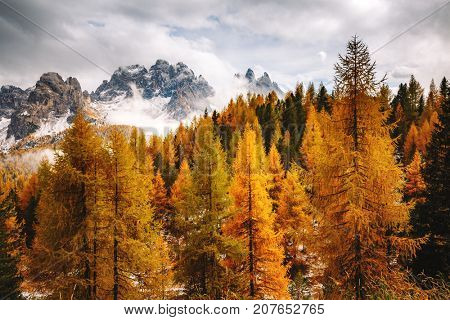 Stunning image of the alpine wallpaper. Dramatic scene, gloomy weather. Location famous place National Park Tre Cime di Lavaredo, Misurina, Dolomiti alps, South Tyrol, Italy, Europe. Beauty world.