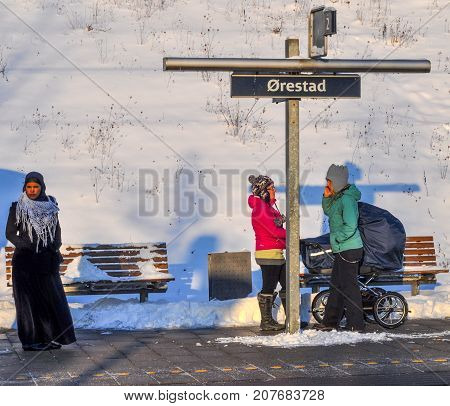 Copenhagen Denmark - Desember 22. 2017: People waiting for the train at Oerestad train station