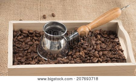 Horizontal view of coffee box with brown coffee grains
