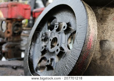 Old diesel engine and spare parts in the workshop.