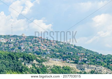 The Black Sea Shore, Green Hills With Houses, Blue Clouds Sky. City Balchik Coast