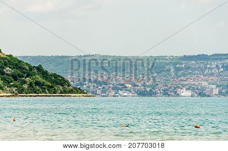 The Black Sea Shore, Green Hills With Houses, Blue Clouds Sky. City Balchik Coast
