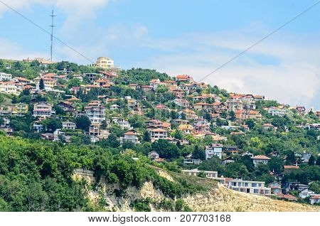 The Black Sea Shore, Green Hills With Houses, Blue Clouds Sky. City Balchik Coast