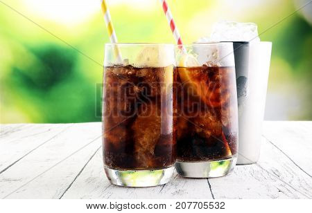 Softdrink With Ice Cubes, Lemon And Straw In Glass
