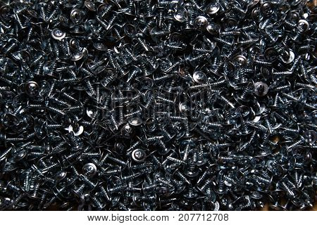 texture of a pile of screws close-up