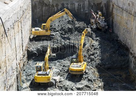 Excavators Baggers Digging At A Construction Site