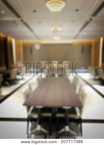 Blurred Image Of Empty Interior Of Conference Room, Meeting Room Prepare For Webinar. Blurry Nobody