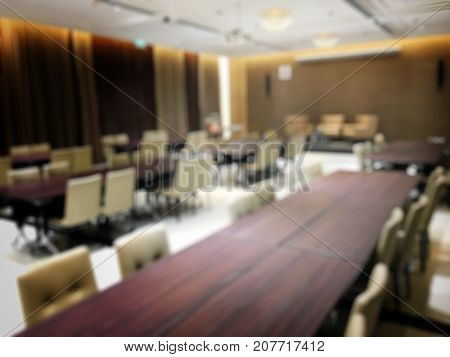 Blurred Image Of Empty Interior Of Conference Room, Meeting Room Prepare For Webinar. Blurry Nobody
