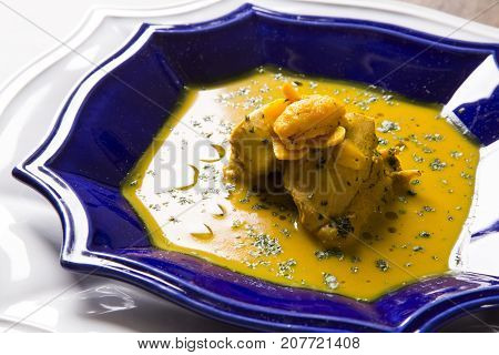 Pequi Fruit With Chicken Over A Wooden Table. Frango Com Pequi.