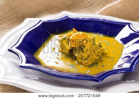 Pequi Fruit With Chicken Over A Wooden Table. Frango Com Pequi.