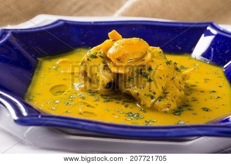 Pequi Fruit With Chicken Over A Wooden Table. Frango Com Pequi.