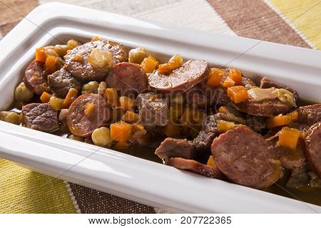 South American Cuisine: Puchero Soup With Sausage. Close-up In A Pot On The Table.