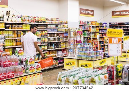 MANAVGAT, TURKEY - 1 OCTOBER , 2017: Interior interior of stiles and refrigerators with products of Migros supermarket in Manavgat, Turkey