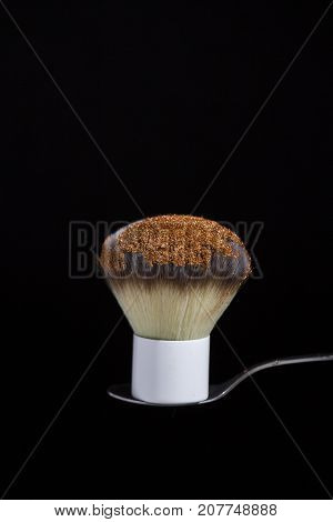 fluffy brush for powder or blush on a black background