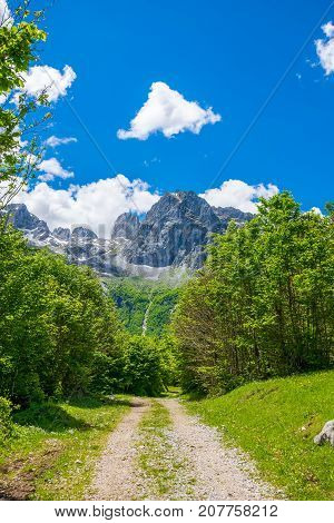In The Mountains Lies A Winding Rocky Road.