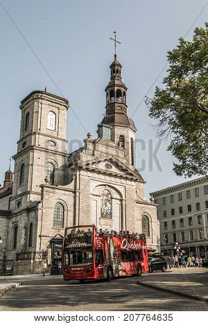 Quebec City Canada 13.09.2017 Touristic Hop On Hop Off Bus in front of Cathedral basilica of Notre-Dame de Quebec part of Old town UNESCO world heritage