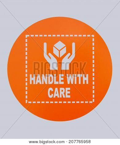 Photo of Handle With Care sign. This photo was taken from sign board.